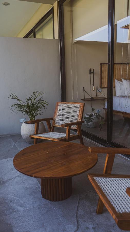 Xperience Tulum Hotel Exterior photo A rattan chair